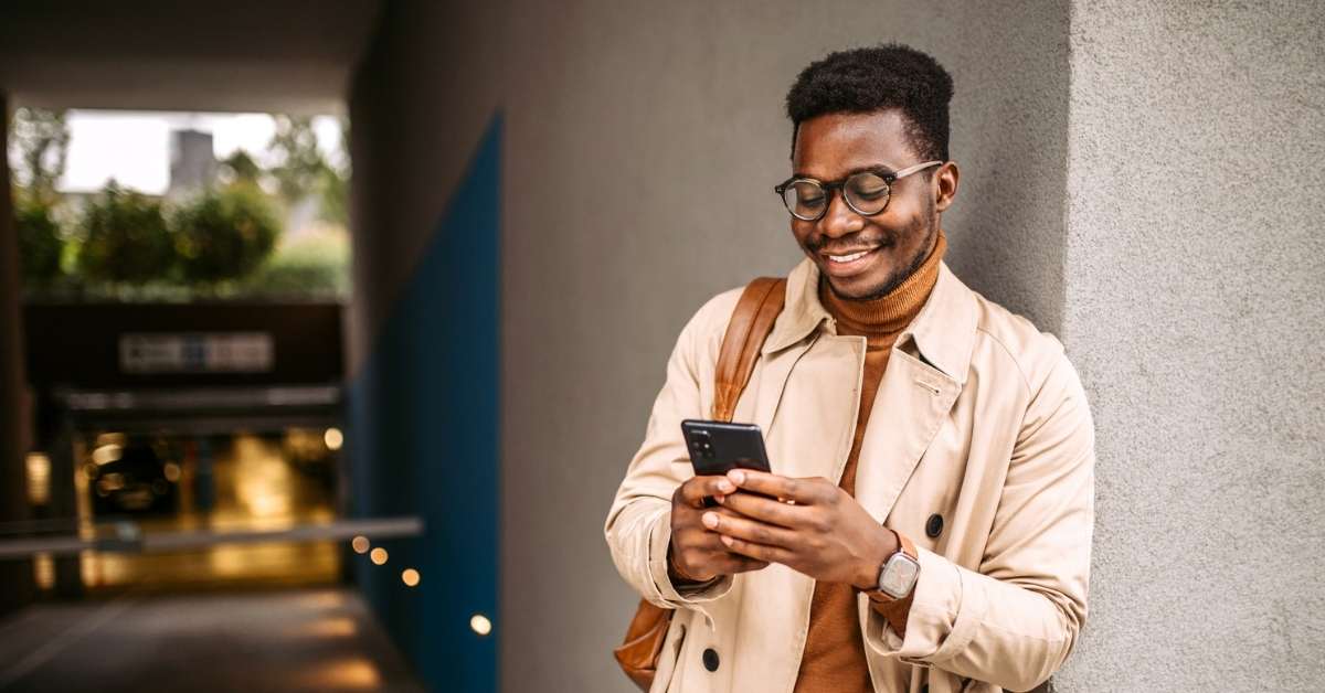 Employee checking the details of their Bolt work taxi on their phone