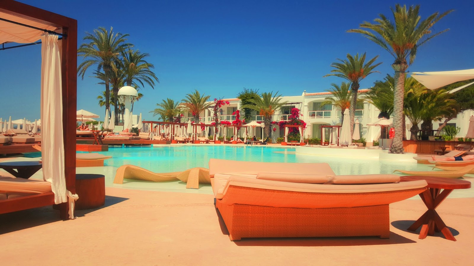 hotel pool with beach chairs
