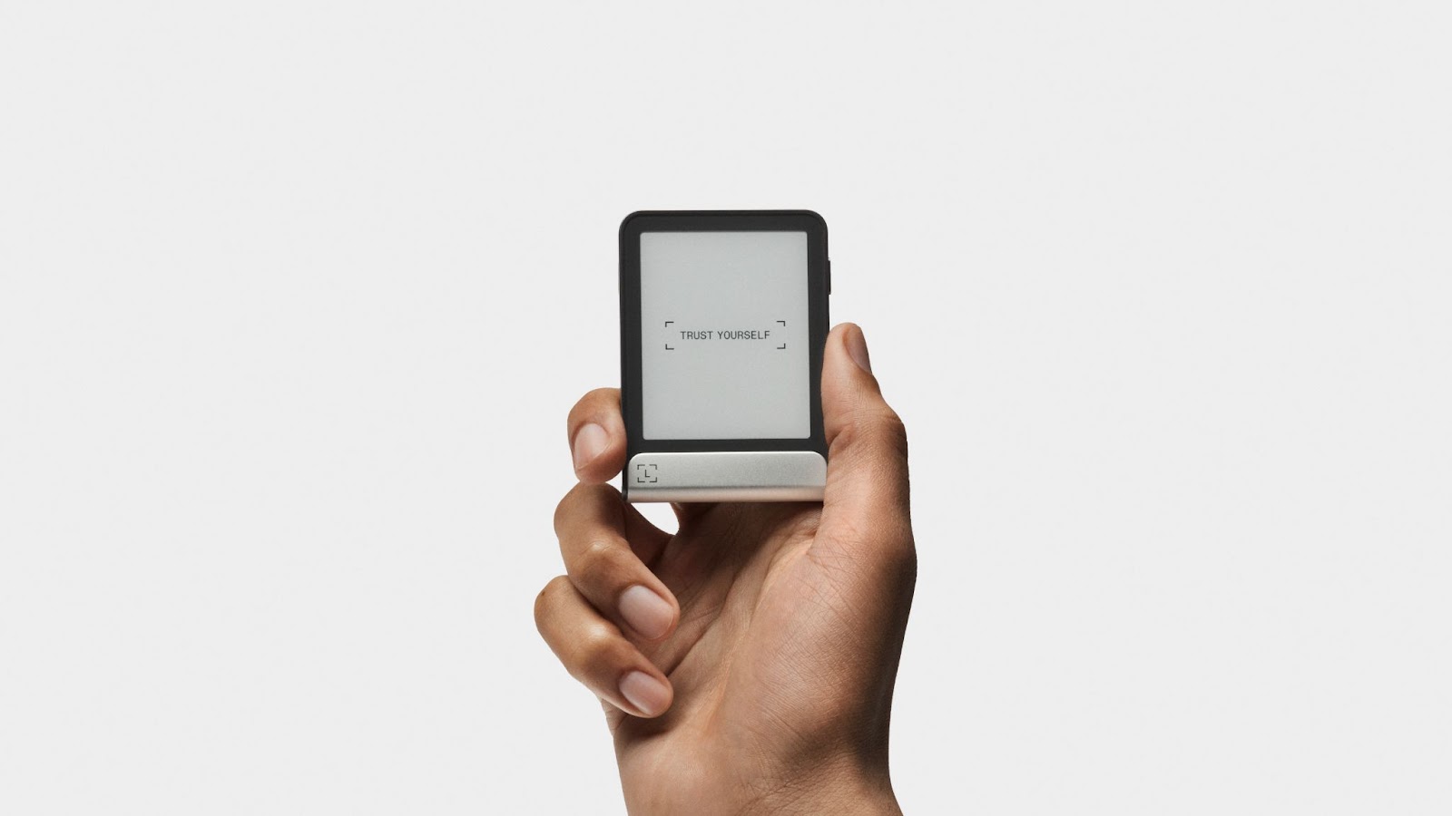 Ledger Flex crypto hardware wallet with an E Ink touchscreen reading Trust Yourself in a hand