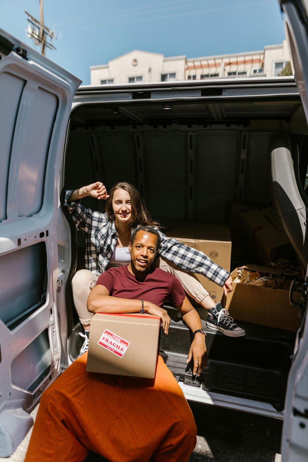 https://www.pexels.com/photo/a-couple-sitting-inside-the-van-7464510/