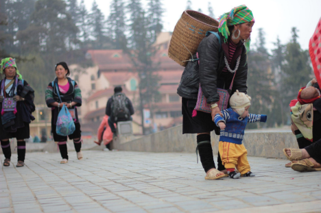 woman picking up child